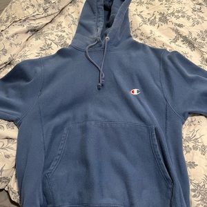 small blue champion hoodie slightly worn